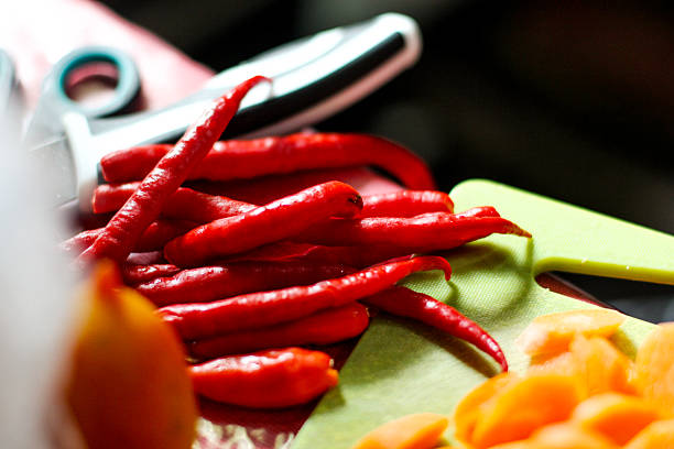 close up of fresh red chilies on the table