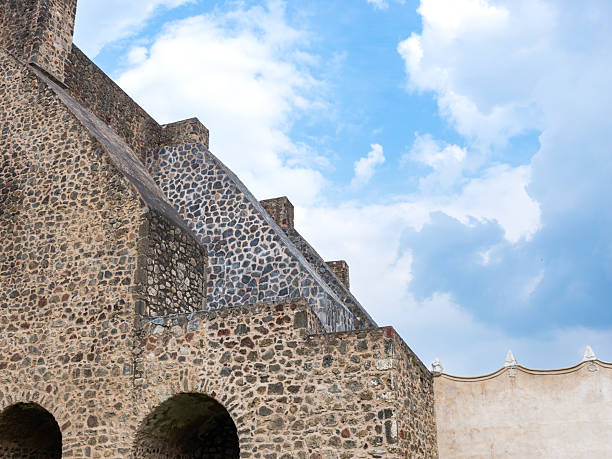 Majestic Stone Architecture of Ancient Building with Cloudy Blue Sky