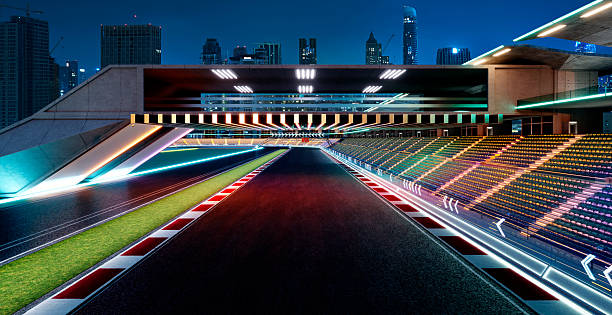 Empty urban racetrack stadium showcasing modern architecture and colorful illumination at night. 3d rendering