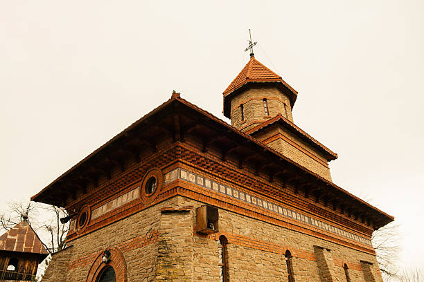 Rustic Monastery Tower, Warm Brick Textures, Decorative Wooden Eaves And Carved Frieze, Small Cupola And Tiled Roof, Weathered