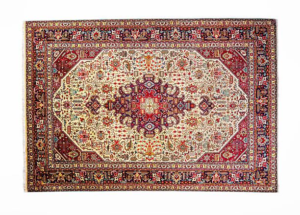 hand-woven wool or silk blend Persian rug featuring intricate curvilinear floral and vine patterns, a detailed central medallion, and multiple borders on a light ivory background, isolated on white