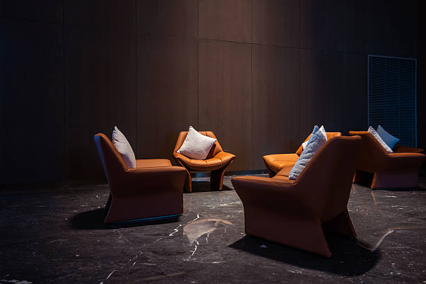 Sofas and cushions in the dim lighting of the lobby