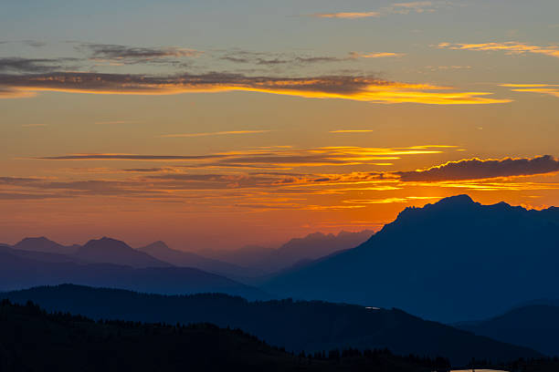 Clouds over the mountain peaks in the Dolomites Italy during a beautiful springtime sunset near Cortina D'Ampezzo.