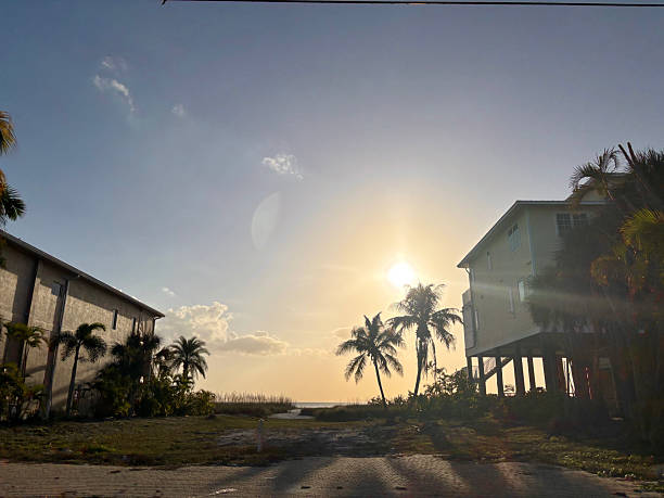 Fort Myers Beach, Florida, showing coastal real estate development with buildings near the ocean at sunset, highlighting the resilient spirit of the community post-hurricane