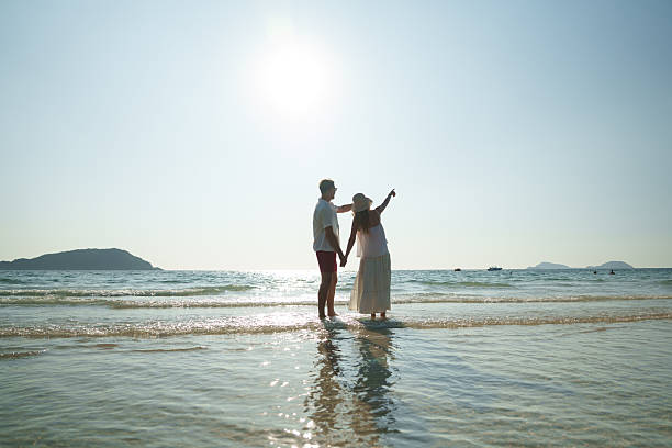 The couple enjoyed themselves on the beach at sunset.