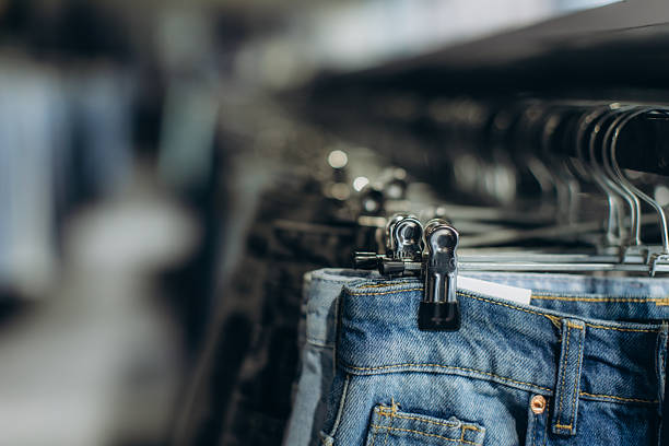 Fashion changes fast and forces consumers not only by their budget but also by their diet and physical appearance. The image depicts lower body female dummies broken at the level of their stomachs. The dummies are made to wear narrow blue jeans.