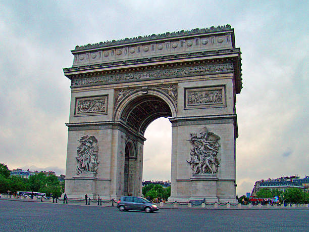 The Arc de Triomphe stands prominently at the center of Place Charles de Gaulle in Paris, France. The historic monument honors those who fought and died for France and remains one of the city’s most recognizable architectural landmarks.