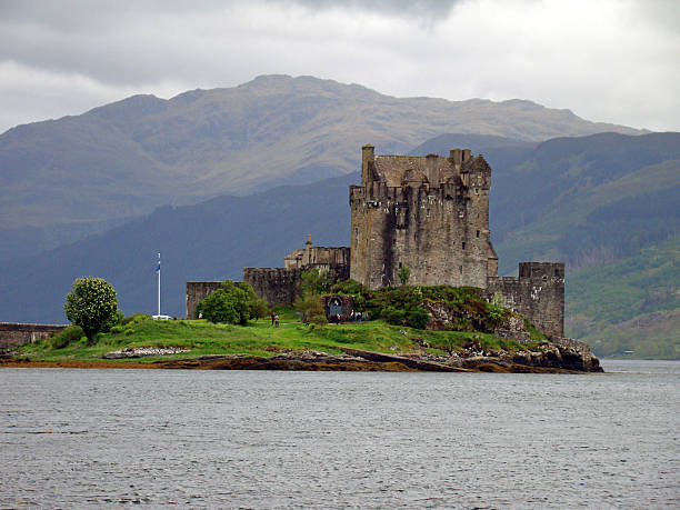 Eilean Donan Castle stands at the meeting point of three sea lochs in the Scottish Highlands of Scotland. Surrounded by dramatic mountain scenery and water, the historic stone castle is one of the country’s most iconic and photographed landmarks.