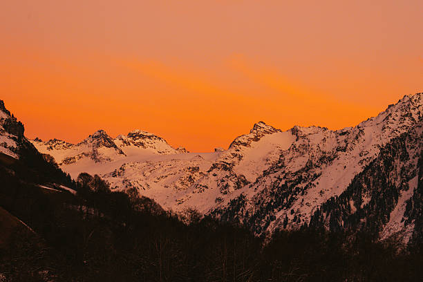 Snowcapped mountain at twilight, Engadine, Graubunden Canton, Swiss Alps