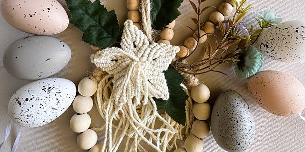 Detailed shot of a handmade bead bunny and speckled eggs for Easter (Ostern). High-quality printing and product catalogs.