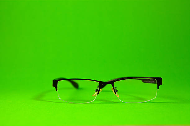 Glasses on green background. Glasses on a green background.