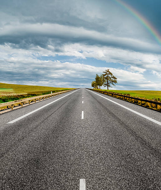 Country road in green hilly landscape