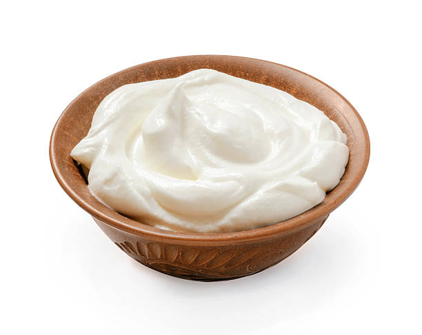 istock Sour cream or yogurt in ceramic bowl isolated on white background 2256617333