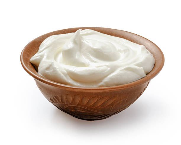 istock Sour cream or yogurt in ceramic bowl isolated on white background 2256617354