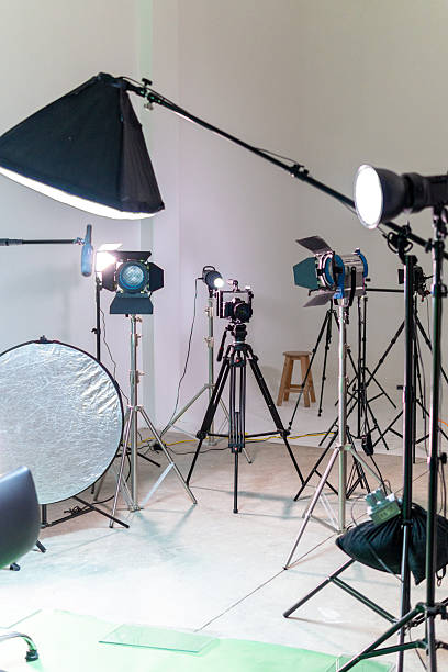 istock Empty film studio set with camera and lighting equipment 2256622351