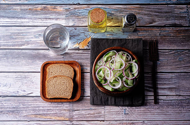 Cucumber red onion sesame seeds salad in a bowl. toning