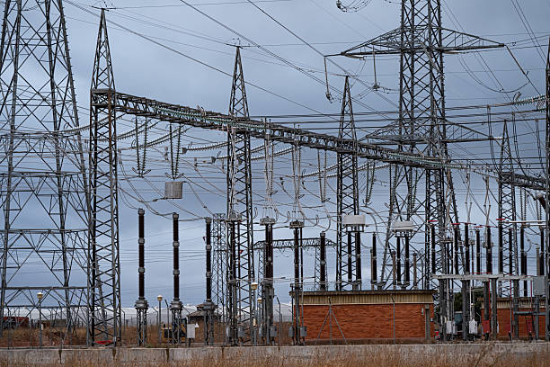Electrical substation next to a high-voltage power line. Power line transmission tower in Spain. High-voltage electricity distribution. Tordesillas, Valladolid, Castile and León, Spain, Europe - October 22, 2025.