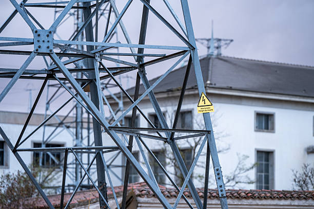 Electrical substation next to a high-voltage power line. Power line transmission tower in Spain. High-voltage electricity distribution. Tordesillas, Valladolid, Castile and León, Spain, Europe - October 22, 2025.