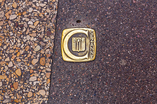 Aix en Provence, France - January 31, 2016: Close up Shot of Golden Sign Famous Painter Paul Cezanne Embedded in Town Street Walk Landmark.