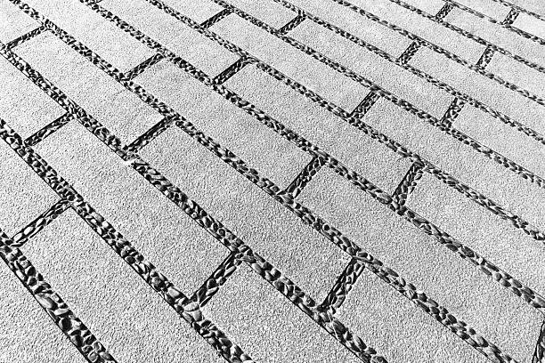 Textured cement flooring background with pebbles