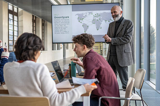 istock Diverse Team Collaborating in Modern Office with a Presentation in the Background 2256707537