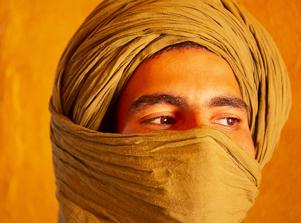 Berber man at sunset in the Sahara desert of Merzouga, Morocco.