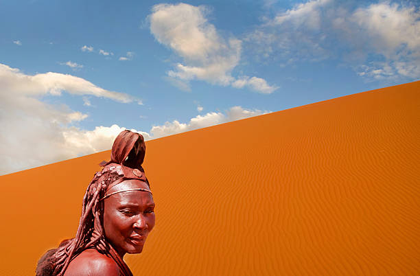 Namibia,  Nomadic woman from Himba tribe.  Namib desert