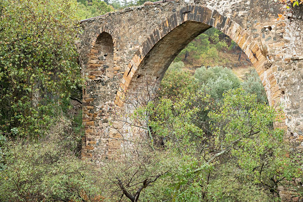 Ancient aqueduct on Greek Island of Chios on an overcast day in late summer or early fall (October). The aqueduct is called Maiden’s bridge and was possibly built during the Roman or Byzantine era. The image was captured with a full frame mirrorless digital camera and a sharp lens at low ISO resulting in a large image file suitable for large prints. The image is part of a large series of photographs of architecture and landscapes on Chios captured at different seasons during many years.
