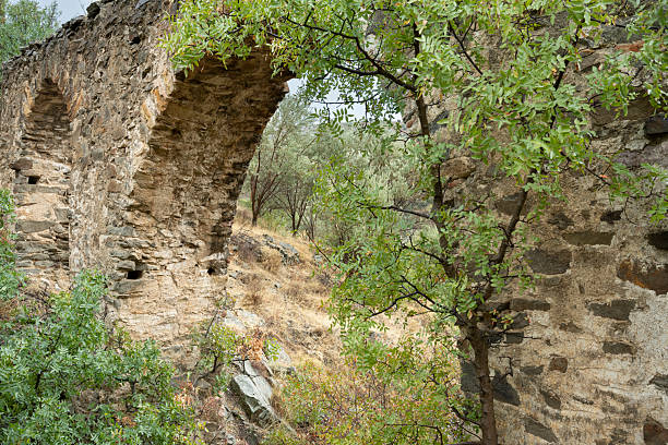 Ancient aqueduct on Greek Island of Chios on an overcast day in late summer or early fall (October). The aqueduct is called Maiden’s bridge and was possibly built during the Roman or Byzantine era. The image was captured with a full frame mirrorless digital camera and a sharp lens at low ISO resulting in a large image file suitable for large prints. The image is part of a large series of photographs of architecture and landscapes on Chios captured at different seasons during many years.