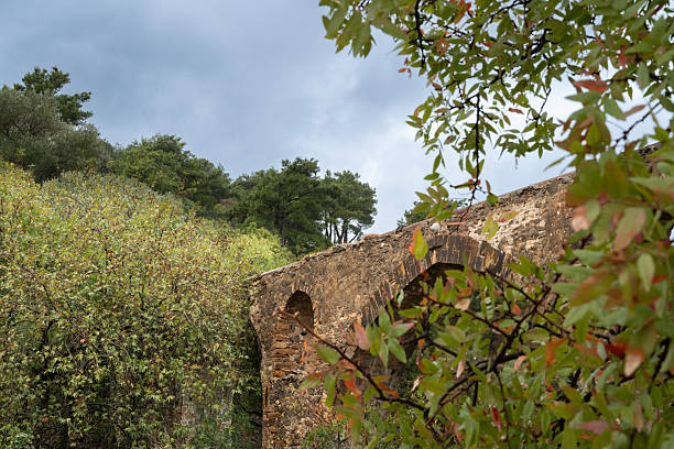 Ancient aqueduct on Greek Island of Chios on an overcast day in late summer or early fall (October). The aqueduct is called Maiden’s bridge and was possibly built during the Roman or Byzantine era. The image was captured with a full frame mirrorless digital camera and a sharp lens at low ISO resulting in a large image file suitable for large prints. The image is part of a large series of photographs of architecture and landscapes on Chios captured at different seasons during many years.