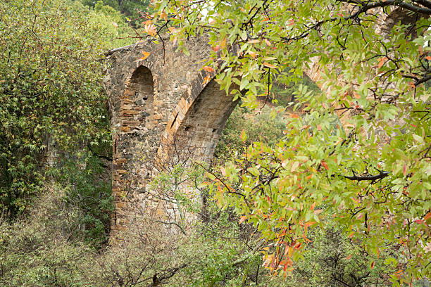 Ancient aqueduct on Greek Island of Chios on an overcast day in late summer or early fall (October). The aqueduct is called Maiden’s bridge and was possibly built during the Roman or Byzantine era. The image was captured with a full frame mirrorless digital camera and a sharp lens at low ISO resulting in a large image file suitable for large prints. The image is part of a large series of photographs of architecture and landscapes on Chios captured at different seasons during many years.