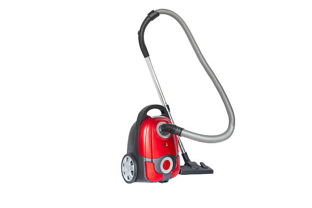 Red vacuum cleaner isolated on white background