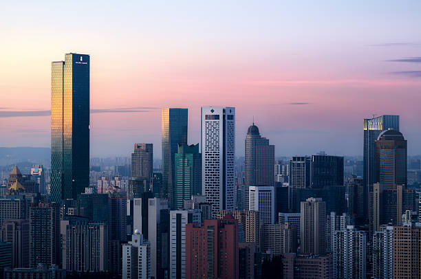 Photos of city of Nanjing in the early morning light, highlighting its horizon and skyscrapers with mountain in the far.