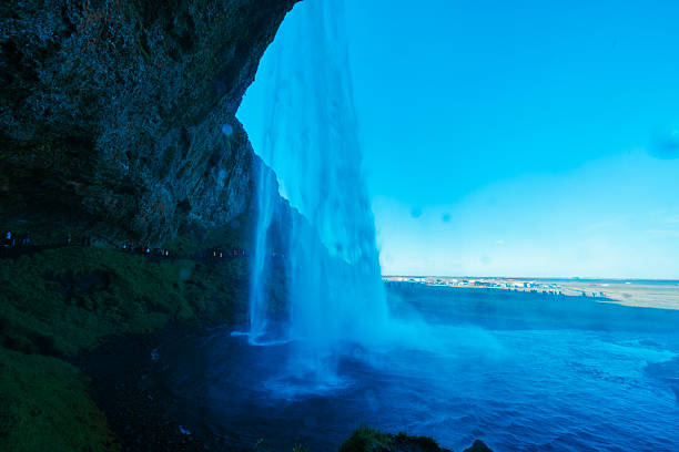 A view of the famous waterfall of Seljalandsfoss on a windy day