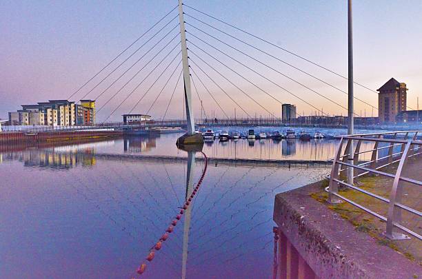 Sail bridge and reflection in Swansea  Wales at twilight