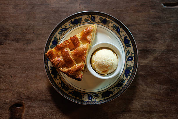 Arabic Cuisine; Traditional Middle Eastern Cheese Kunafa Dessert. A delicious pastry consisting of soft melty cheese and shredded phyllo dough. Served with sugar syrup and crushed pistachio.