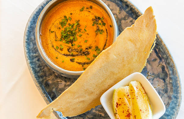Arabic lentil soup with Lebanese herbs, bread and lemon wedges