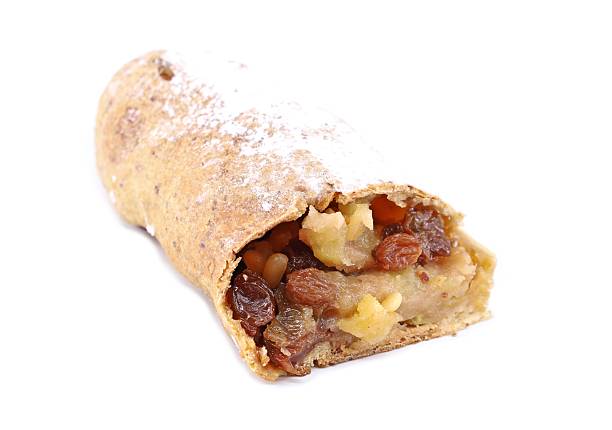 Making of classic strudel fille with apples, cranberries, walnuts and cinnamon