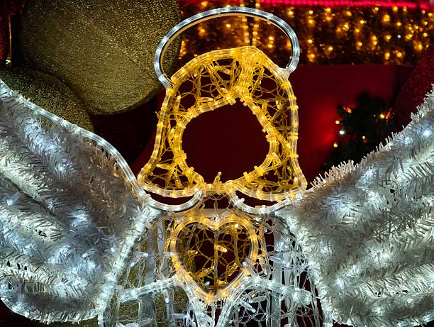 pictured in the photo A Golden Christmas angel is hanging on the branch