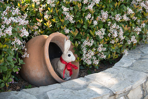 Rabbit easter garden decor. Rabbit cute holiday decoration. Rabbit spring festive symbol. Rabbit playful seasonal ornament