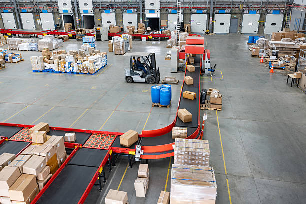 Boxes of merchandise moving in conveyor belts at a distribution warehouse