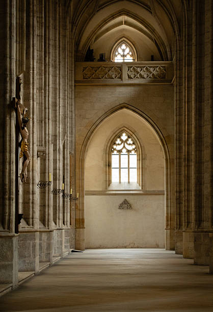 Kutná Hora, Czech Republic  August 8, 2025: Gothic interior with pointed arches, ribbed vaulted ceiling and crucifix sculpture at St. Barbara's Cathedral in Kutná Hora