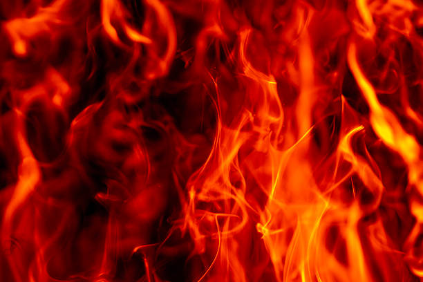 Flame fiery texture on black. Flame sparks with glowing light. Flame burning abstract form. Flame visual effect