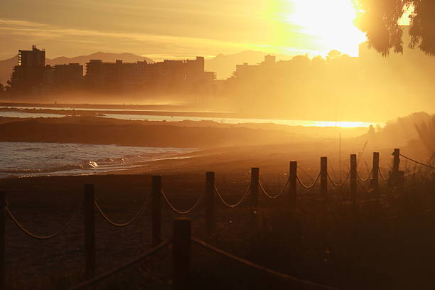 Winter holidays in the Mediterranean. Travel in winter. Sunset colors in the Mediterranean Sea. Mediterranean Light. Sea mist.