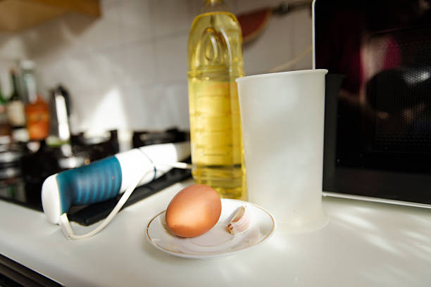 5 eggs being fried in a pan
