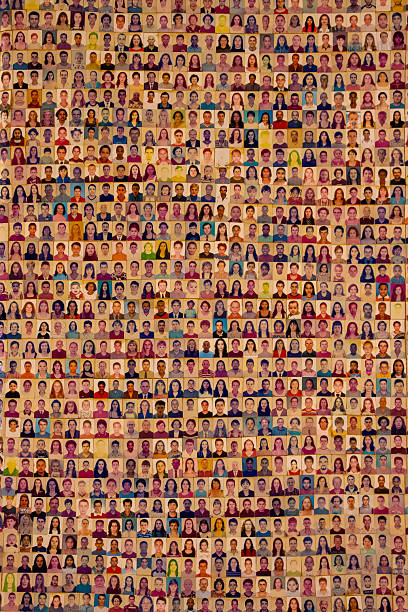 Aparecida, São Paulo, Brazil, 1 3 26: Hundreds of passport-style photos of various people form a large, diverse collage on a wall at Santuario Nacional de Nossa Senhora Aparecida.
