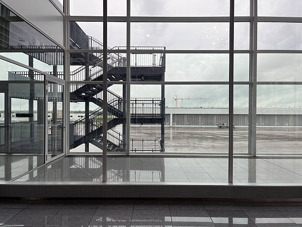 Paris airport with a stunning steel and glass facade shining in sunlight, capturing the essence of modern travel.