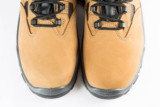 new pair of leather safety shoes on white background