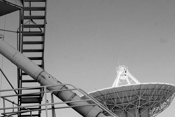 Close up of the access to giant radio telescope, and the antennae of another, at the Very Large Array (VLA), NM. 2025