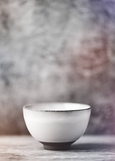 Traditional japanese ceramic on rustic wooden background. Soft focus. Copy space.